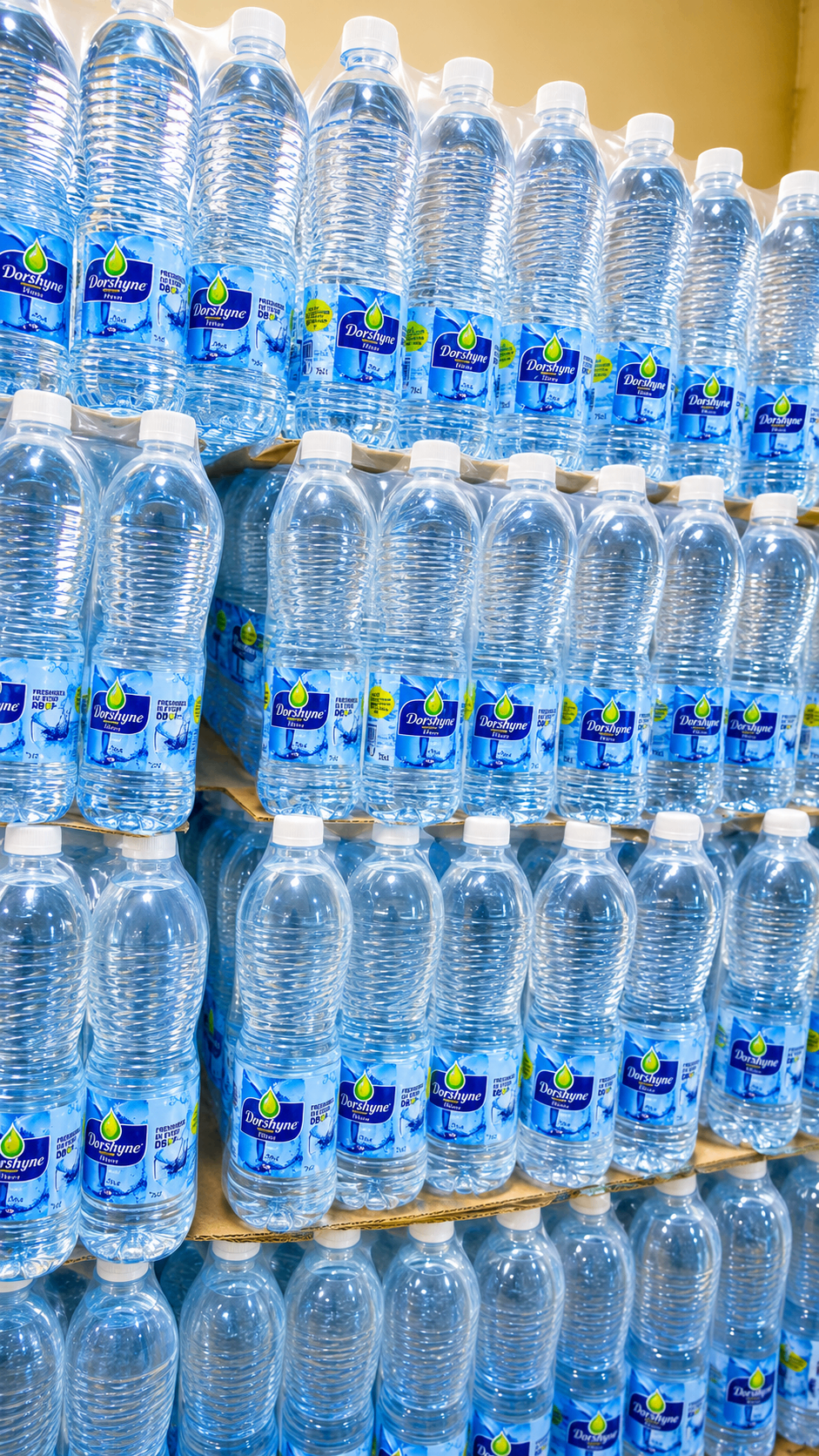 Pallets of Dorshyne Premium Water bottles stacked in the Ogeloks Stores warehouse